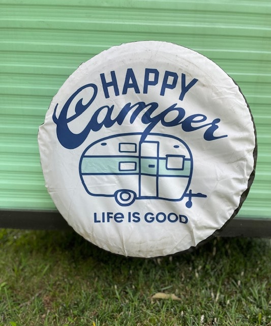 rear view with "Happy Camper" tire cover. Perfect rv rental for your next adventure!|White spare tire cover with "Happy Camper