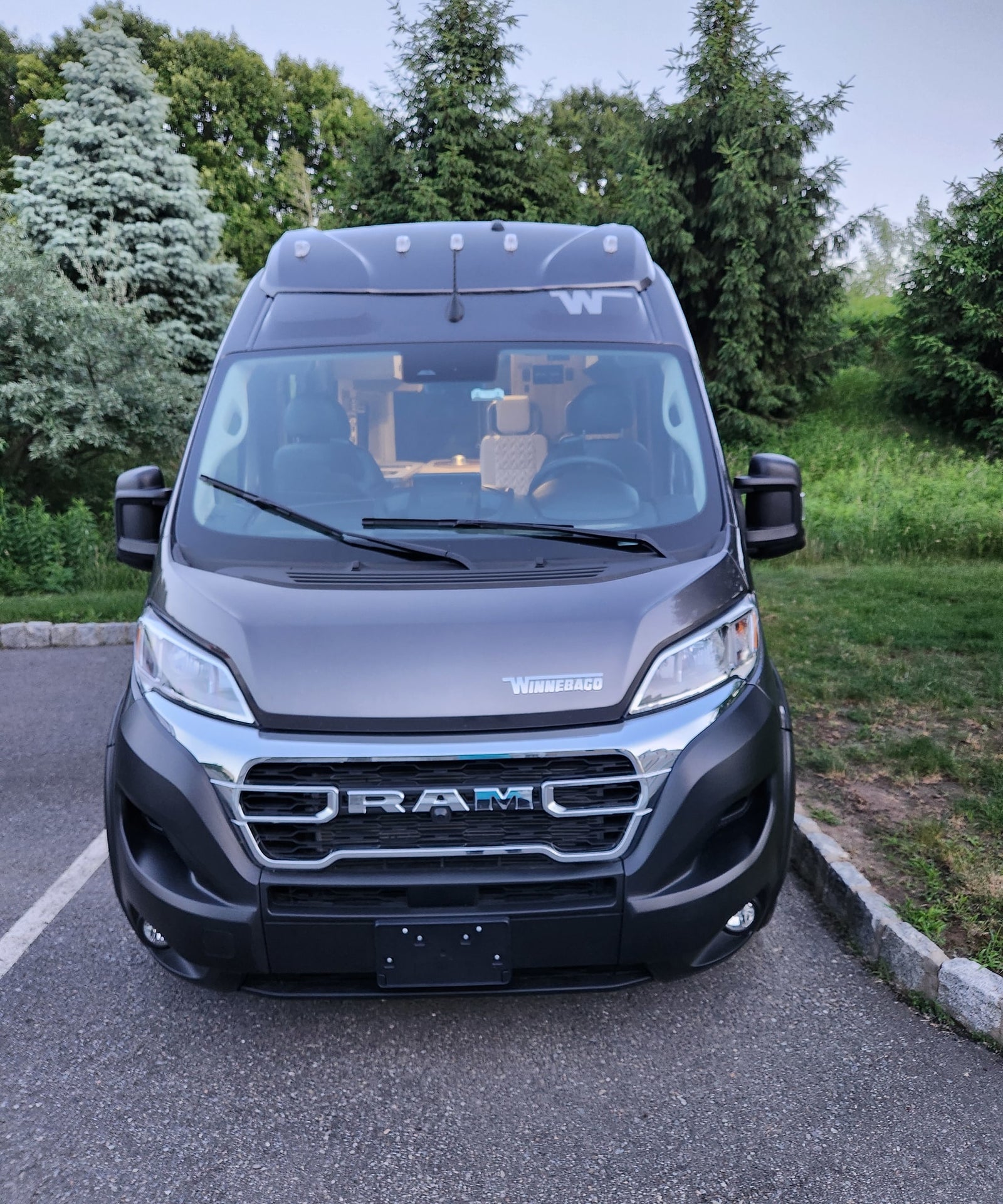 Front of a dark gray Winnebago Ram camper van