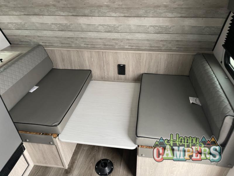 ready for your next RV rental camping trip.|Compact RV rental interior: view of the kitchenette with a stove