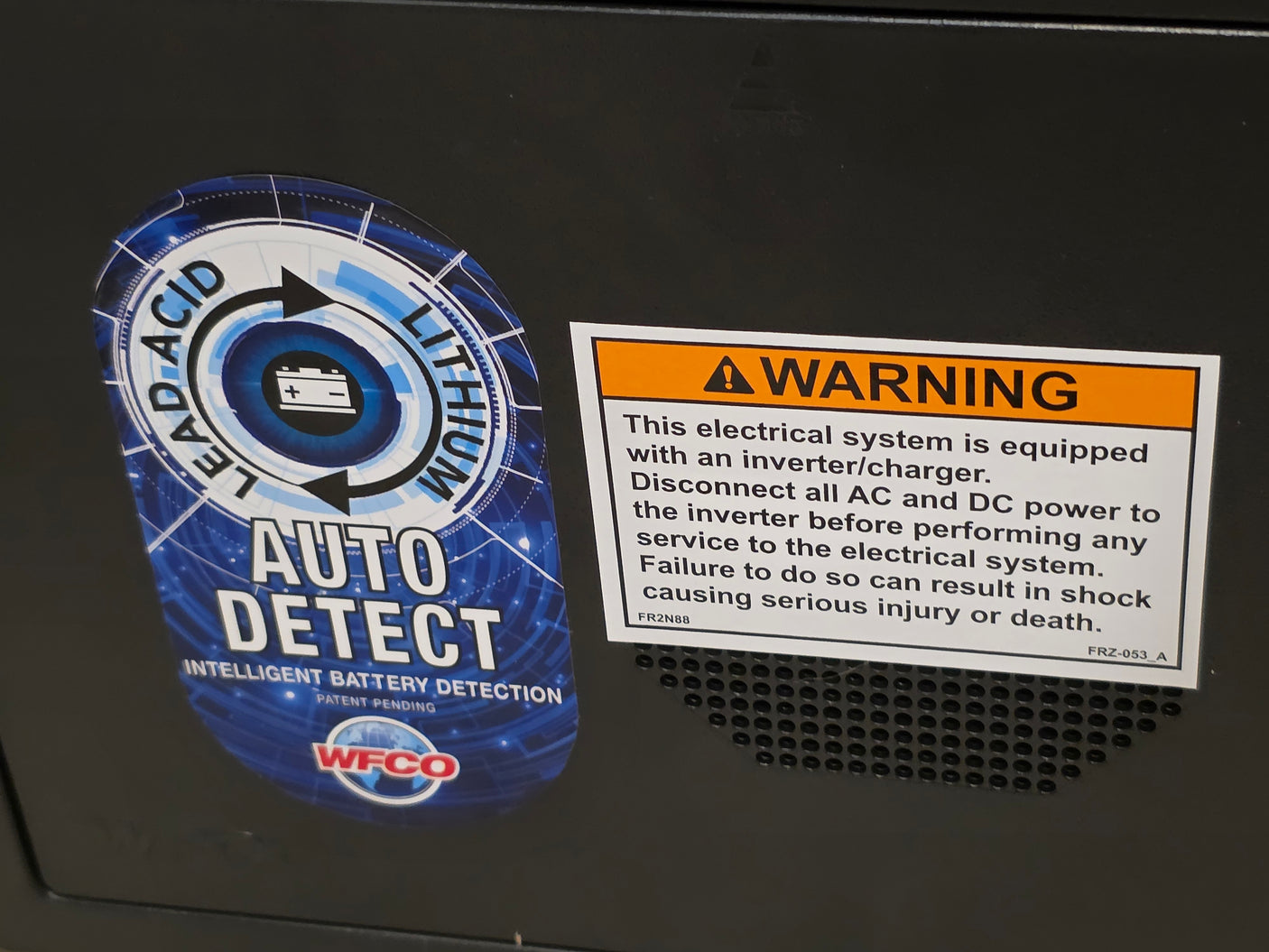 RV rental electrical system with auto-detect lead-acid/lithium battery management and inverter safety warning.