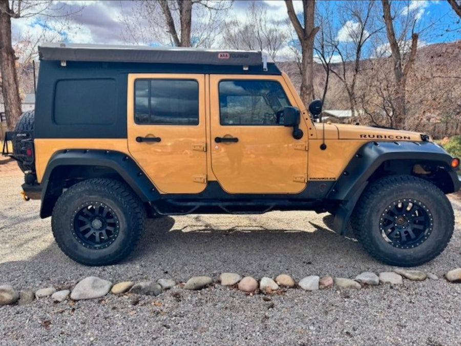 for your next RV rental adventure.|Rugged tan leather back seats and visible roll bar inside this off-road vehicle. Excellent choice for an rv rental.|Inside an RV rental pop-top camper