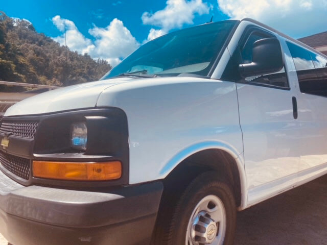 White van, perfect for your next RV rental road trip or outdoor adventure under a sunny sky.