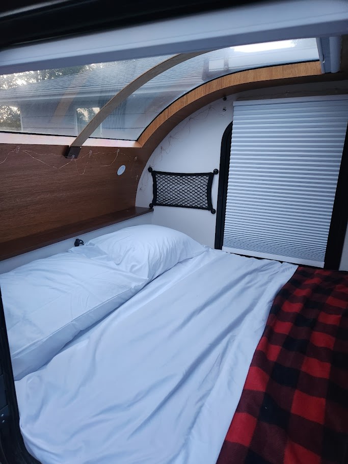 ready for adventure.|Cozy RV rental interior with a comfortable bed