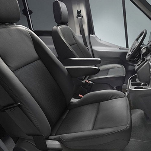 RV rental interior features comfortable black driver and passenger seats, ideal for comfortable travel.