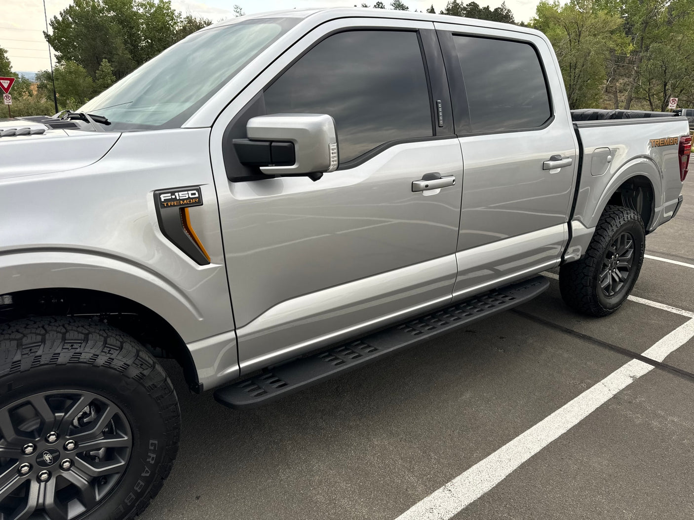 Silver Ford F-150 Tremor pickup truck, ideal for outdoor adventures or an RV rental trip.