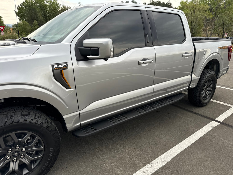 Silver Ford F-150 Tremor pickup truck, ideal for outdoor adventures or an RV rental trip.