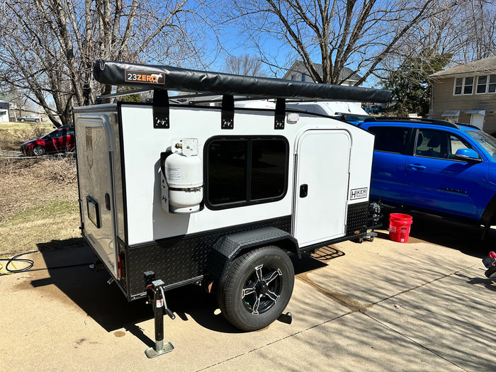 ideal for camping.|A white Hiker Trailer teardrop camper