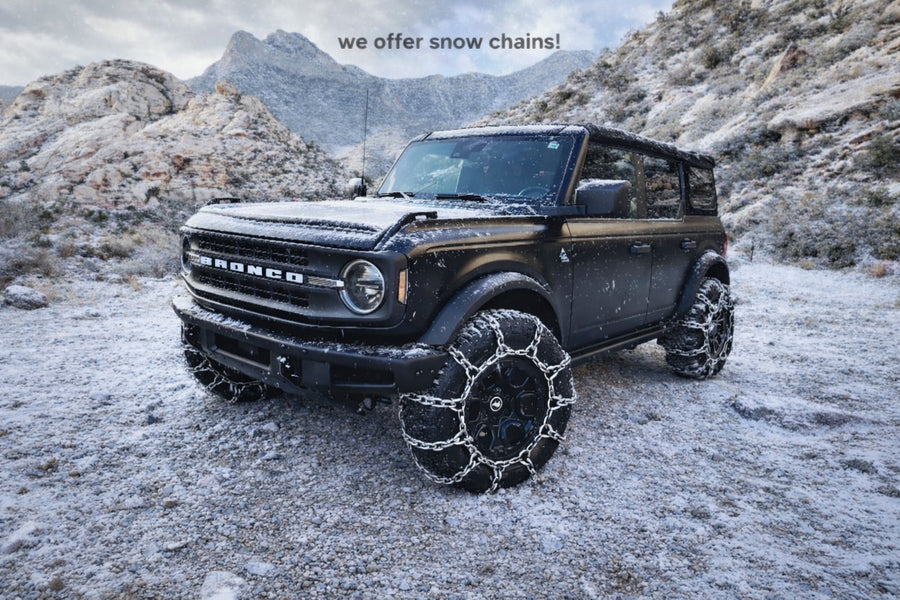 perfect for an RV rental journey.|A rugged black Ford Bronco off-roading in a scenic canyon. Ideal for adventure travel