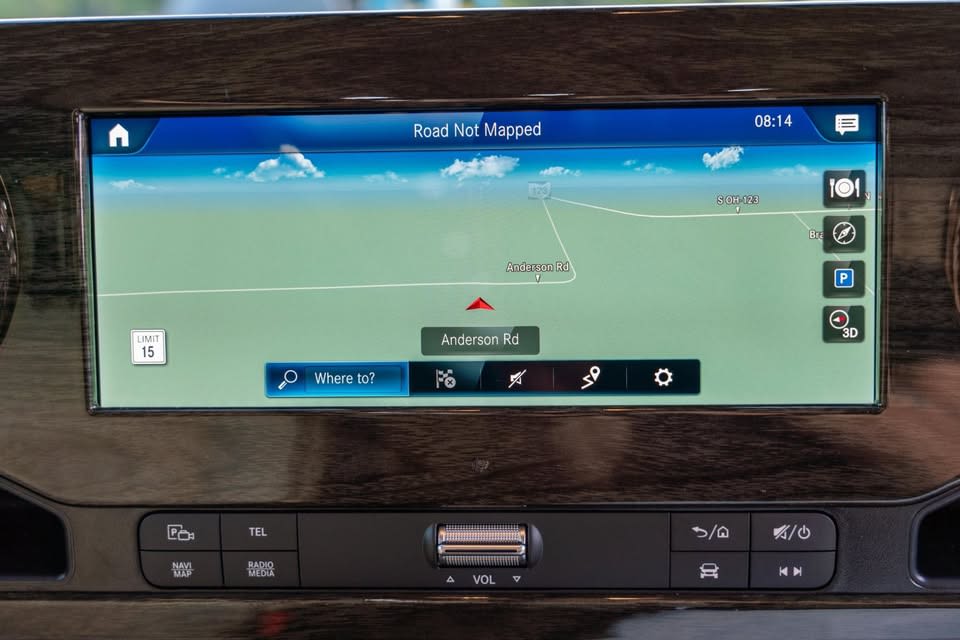 showing Ultimate Coach layout for an RV rental experience.|Open fuel door of an RV rental showing the red DIESEL cap and a green label confirming diesel fuel use.|Plush rv rental interior with cream diamond-stitched captain's chairs