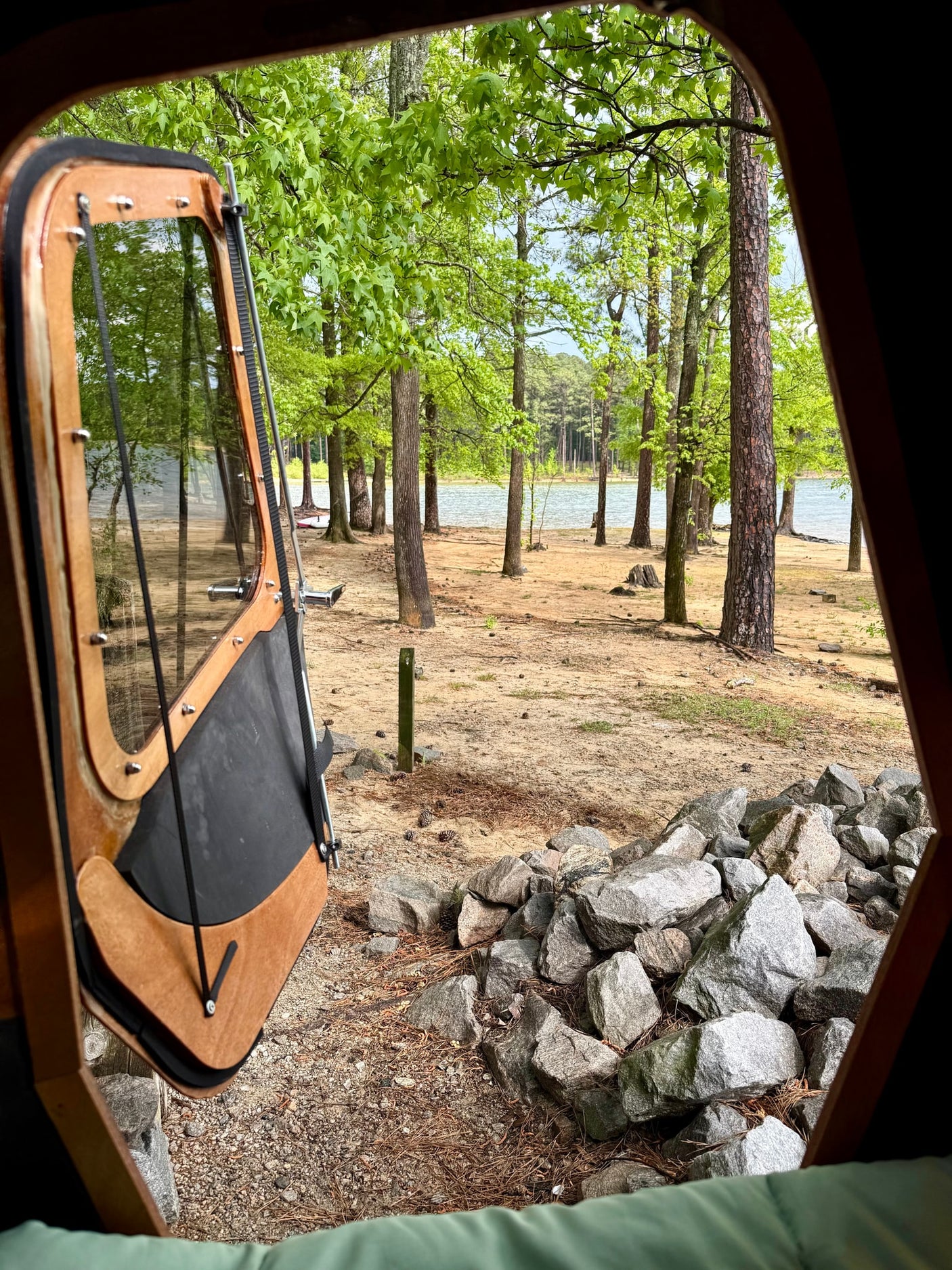 and calm water.|An RV rental's comfy interior with a bed