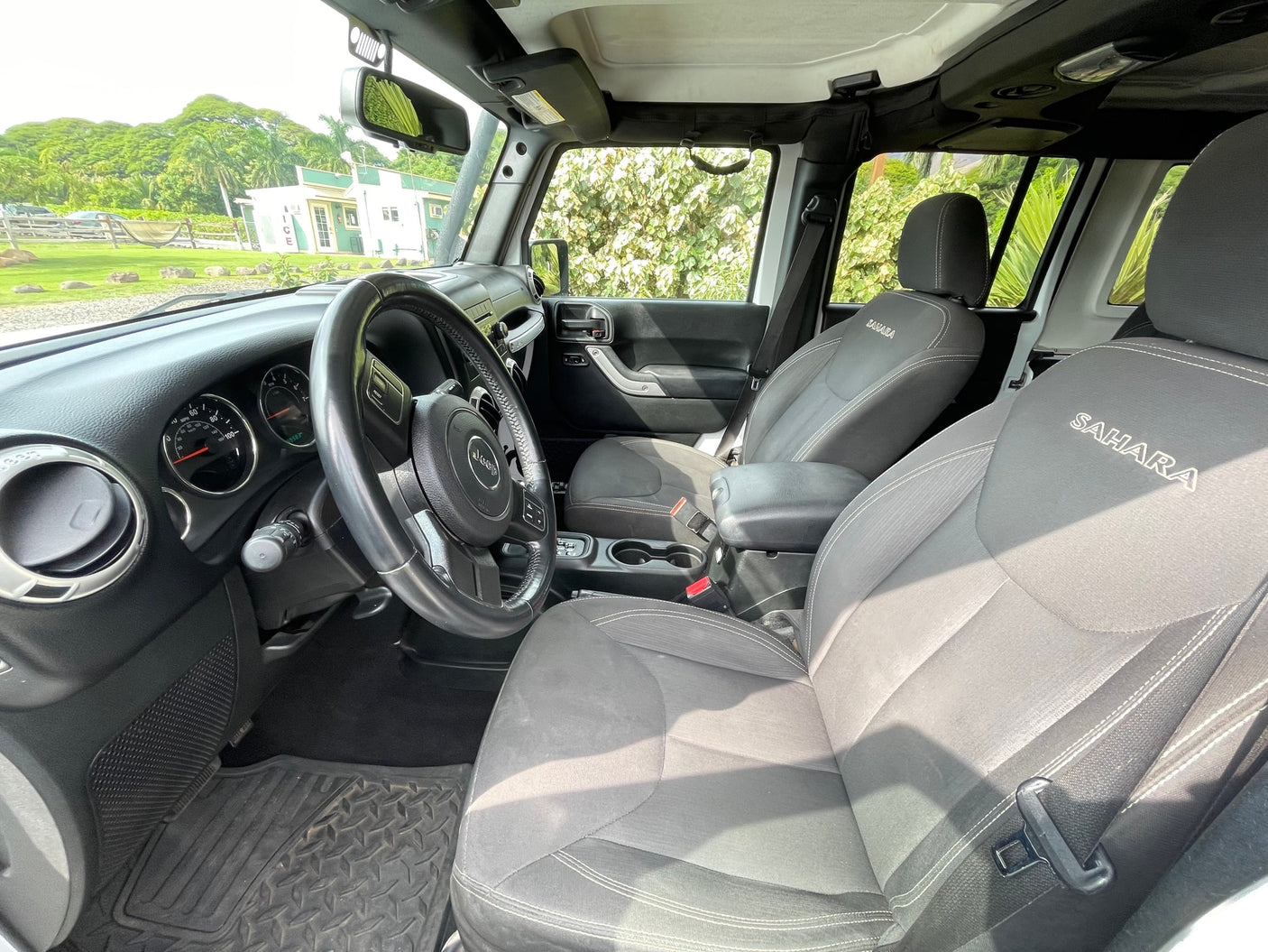 Inside a Jeep Sahara SUV, featuring detailed interior and dashboard. Not an RV rental, but perfect for adventure travel.