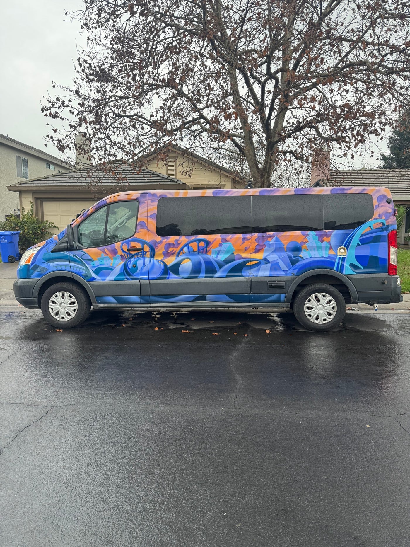 is parked on a wet residential street — photo 3
