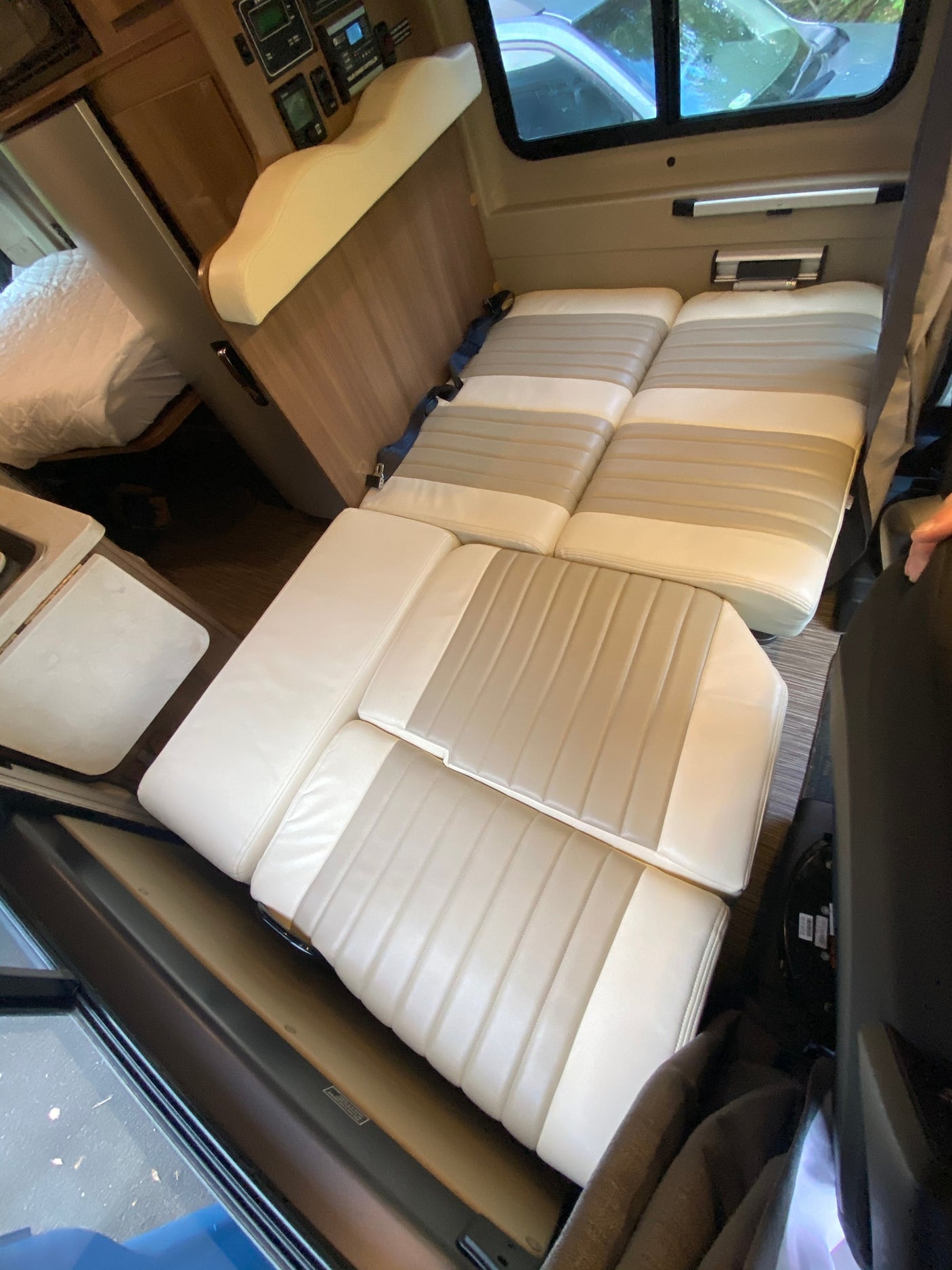 and driver's cabin view for your road trip comfort.|Compact RV rental bathroom: features a toilet