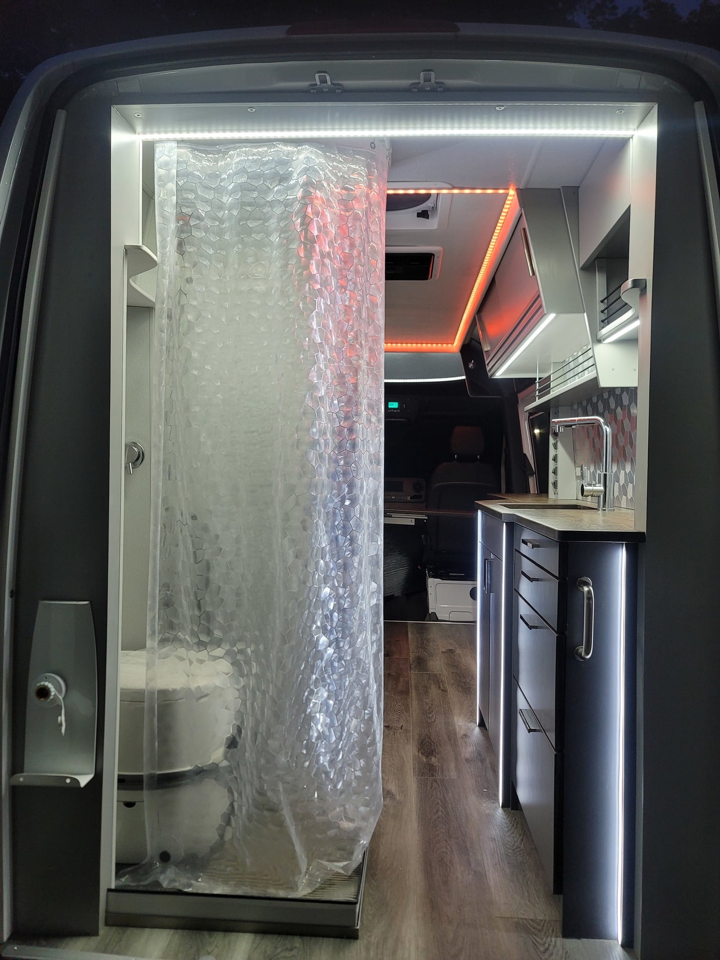 and shower area create a functional mobile home.|An RV rental van