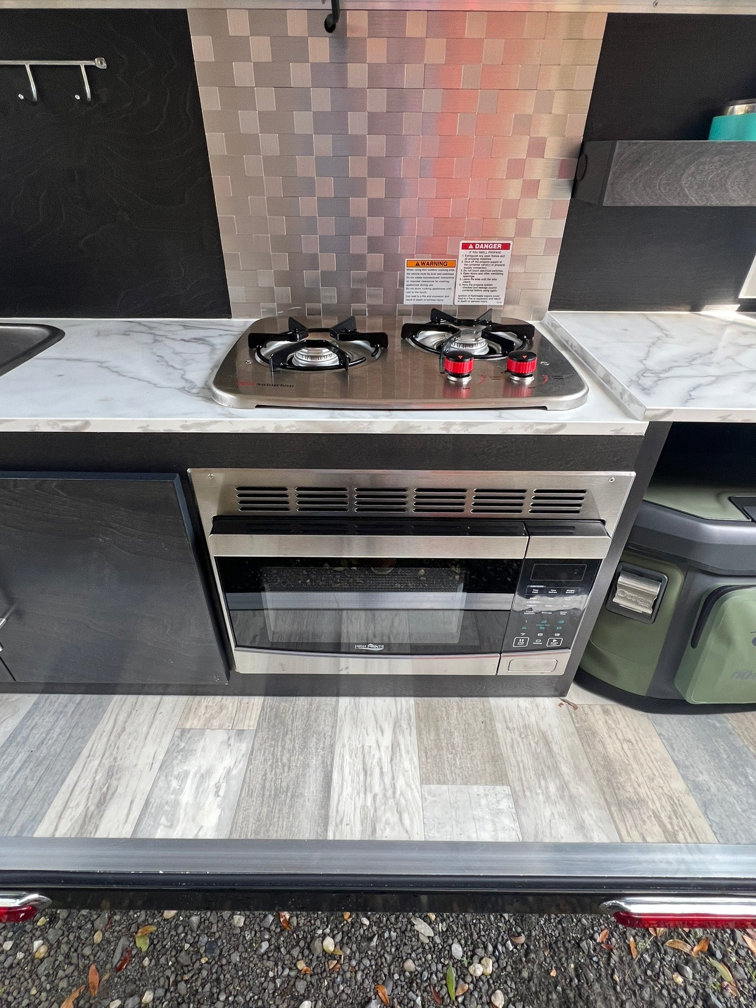 and a window view of the outside.|Comfortable RV rental interior with bed
