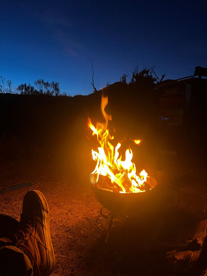 ready for sunset adventure. Gear visible in the rear hatch.|A red Jeep pulls an off-road RV rental trailer