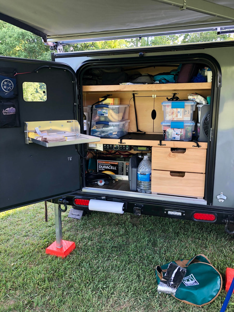 ideal for adventure.|RV rental's convenient outdoor galley with storage shelves