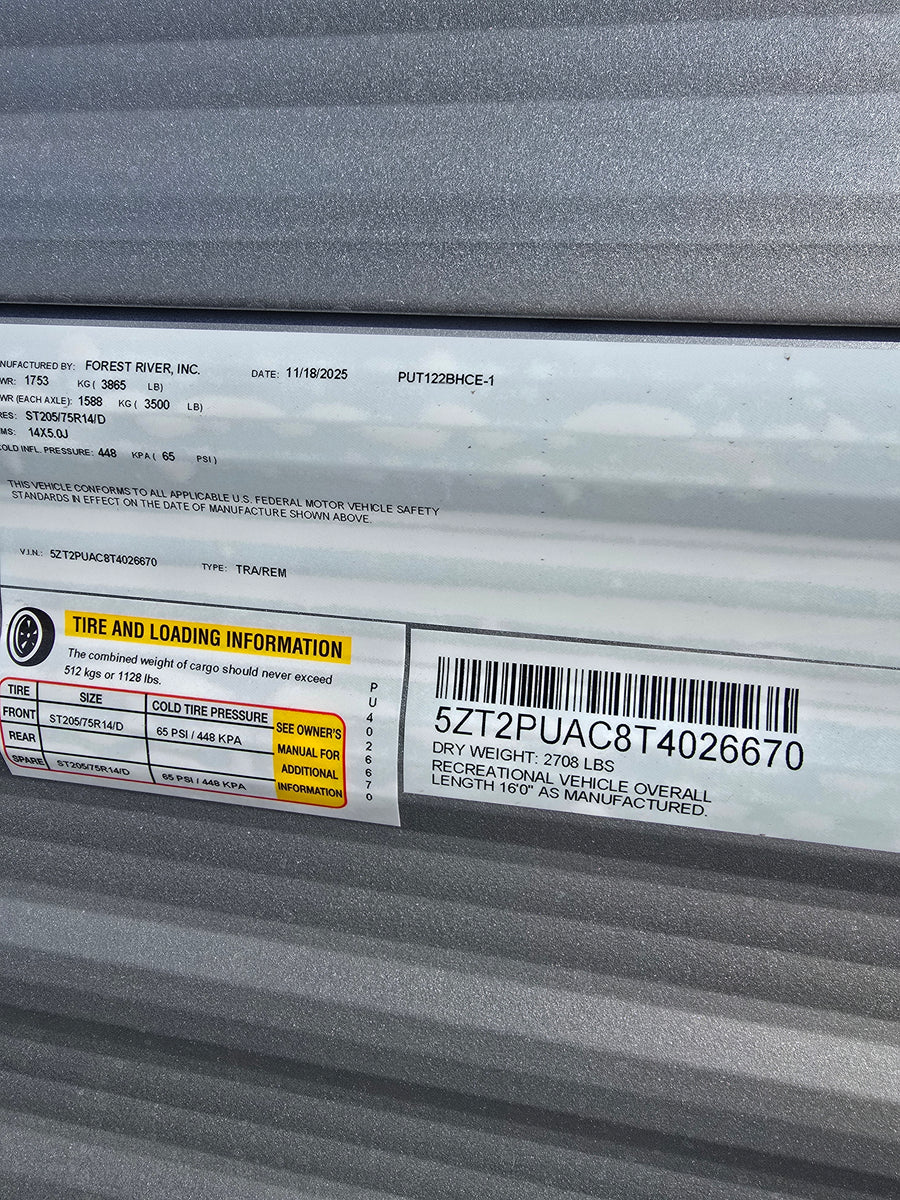 Essential RV rental info: VIN 5ZT2PUAC8T4026670, tire pressure (65 PSI), cargo & dry weight, and length 16'0".