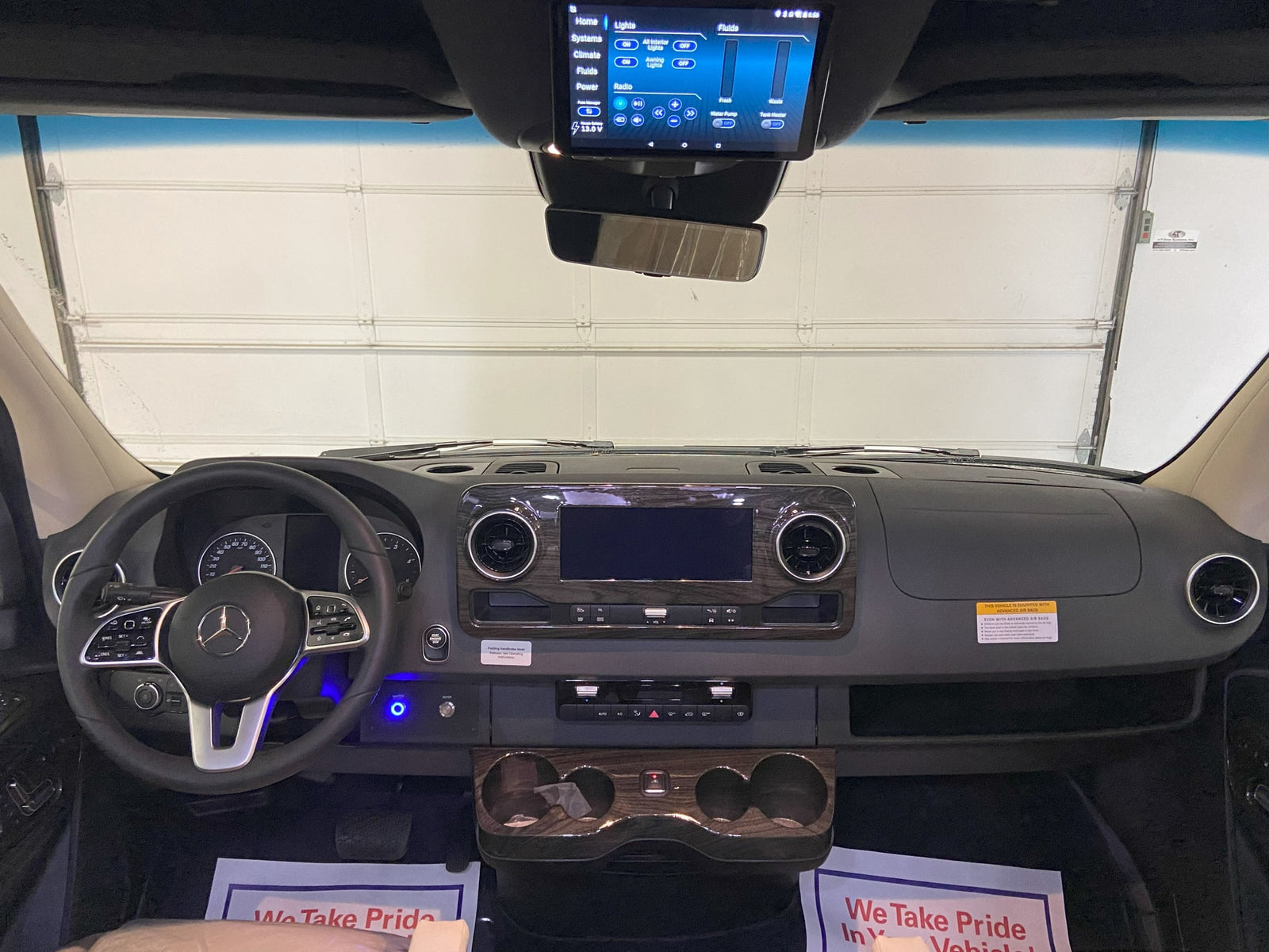 and ambient lighting for comfortable travel.|Mercedes-Benz Sprinter RV rental: luxurious interior with dashboard