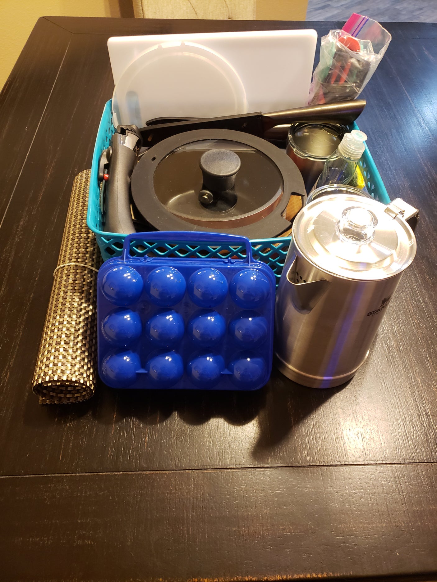 RV rental kitchen kit: Portable cookware, kettle, egg holder, & essentials for easy travel cooking.