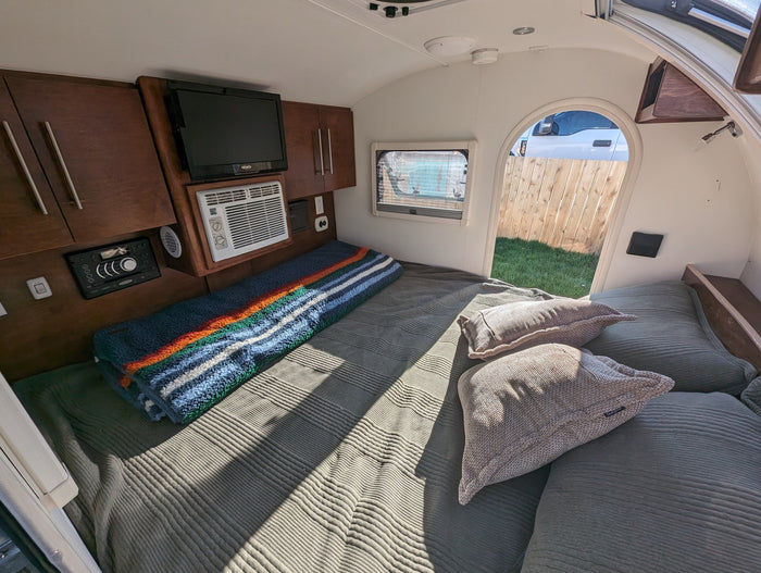 is ready for your next adventure. Parked on sandy ground