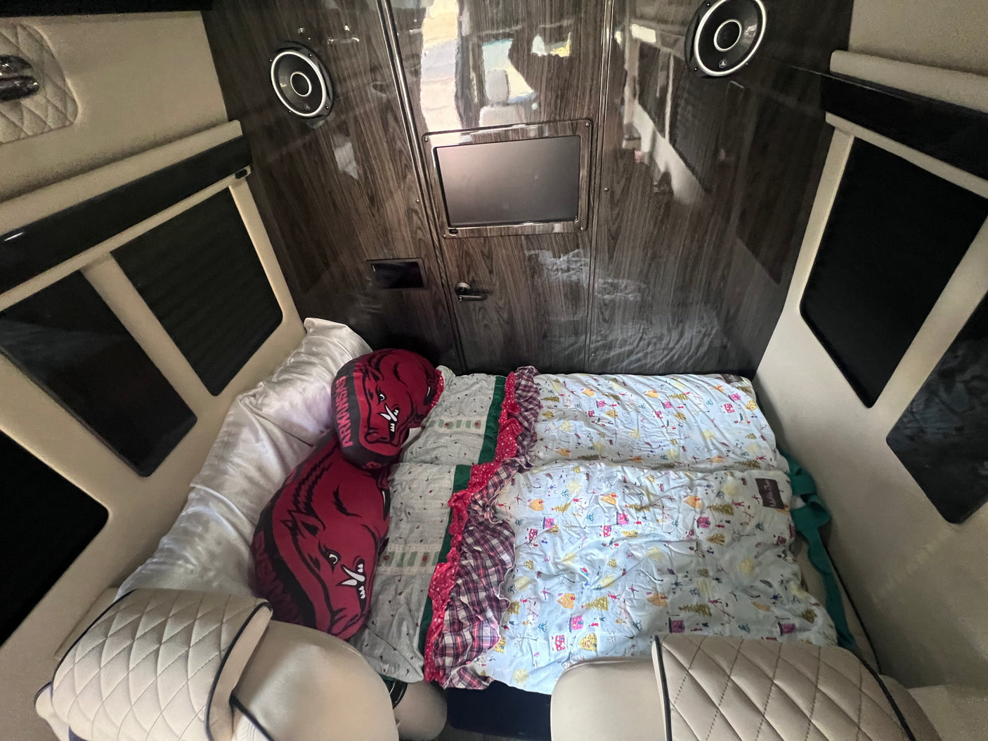and entertainment screen for ultimate comfort.|Luxury RV rental interior with spacious seating