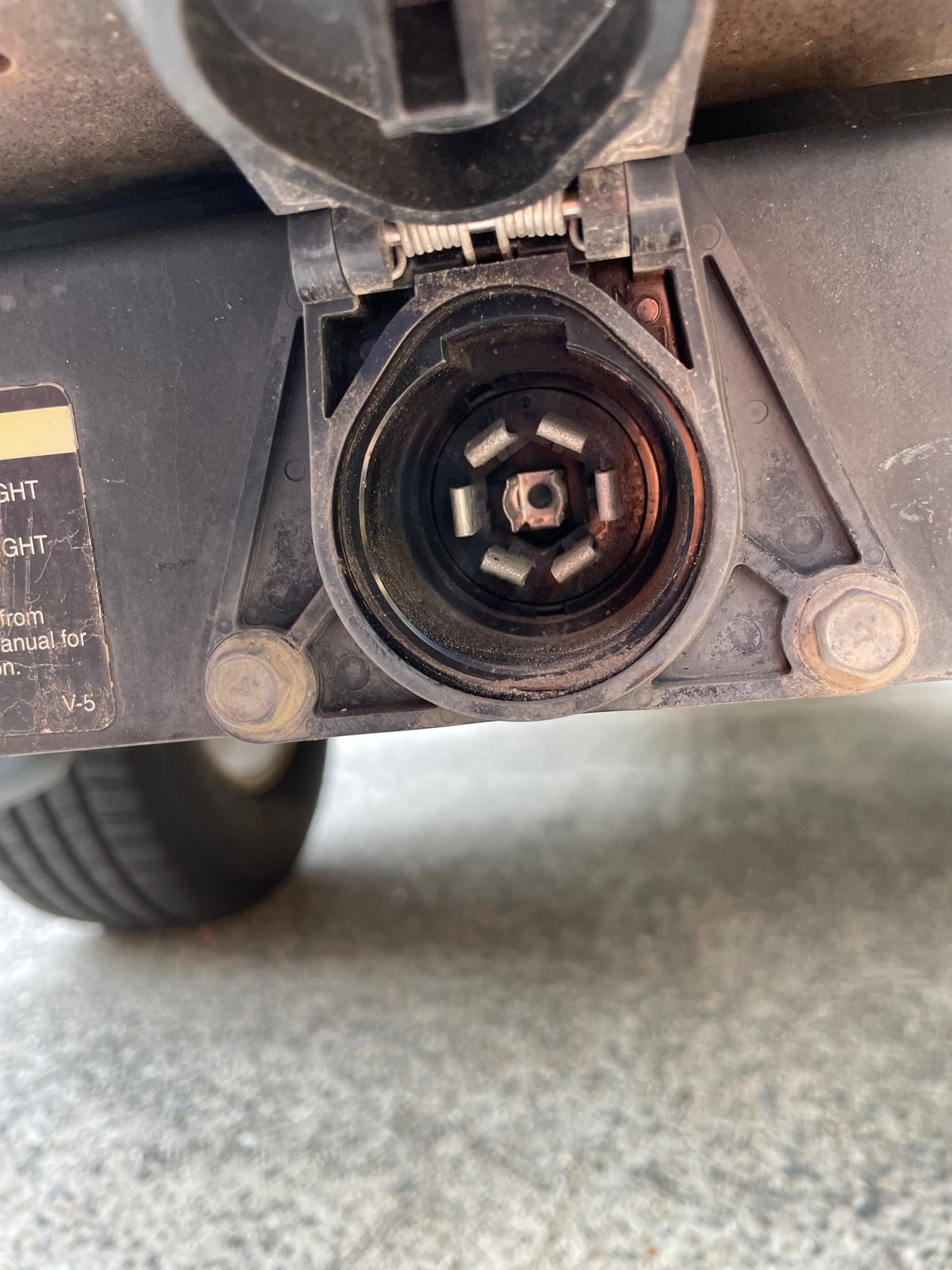 Visually, a dusty 7-pin trailer connector. This essential hitch wiring is key for safely connecting an RV rental or towed trailer.
