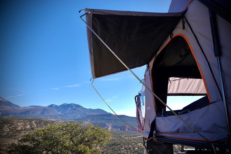 Scenic mountain view from an RV rental's rooftop tent, perfect for camping and outdoor adventures.