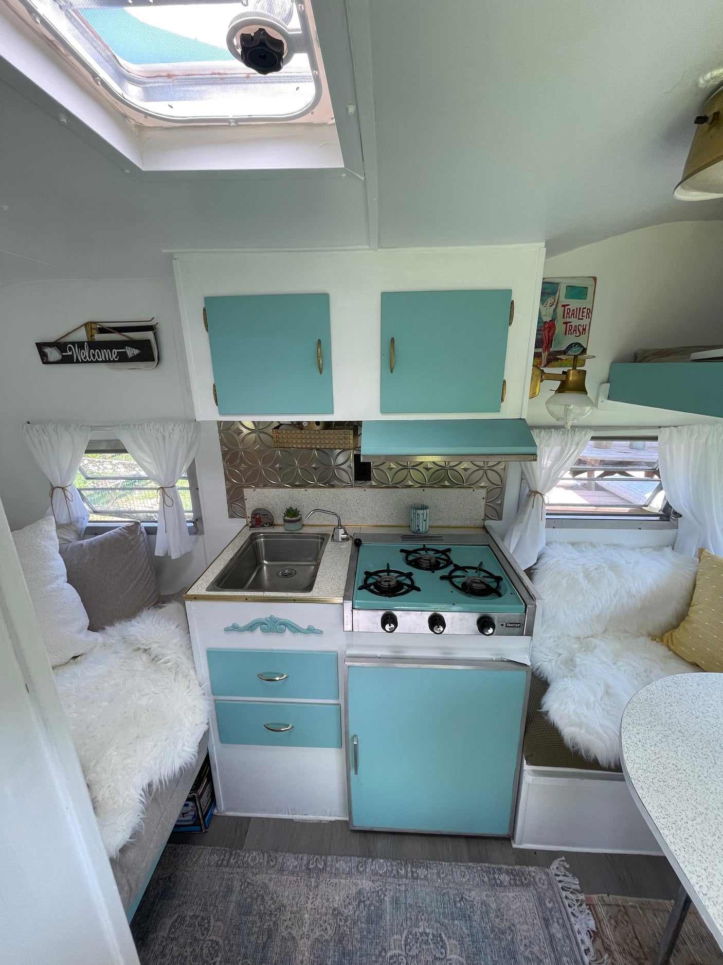 retro camper with a teal kitchenette