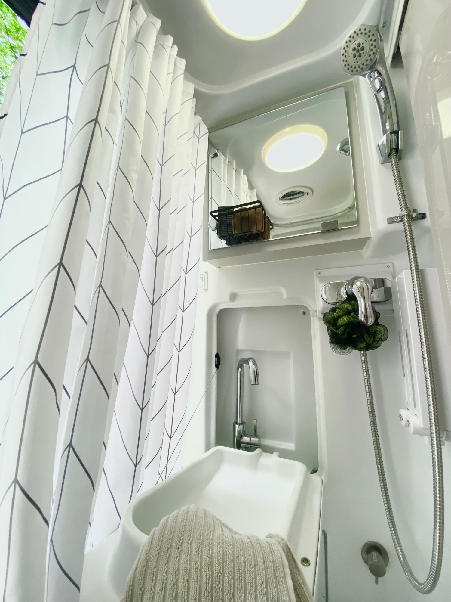 perfect for comfortable mobile living.|Relax in this cozy RV rental bedroom with a quilted bed
