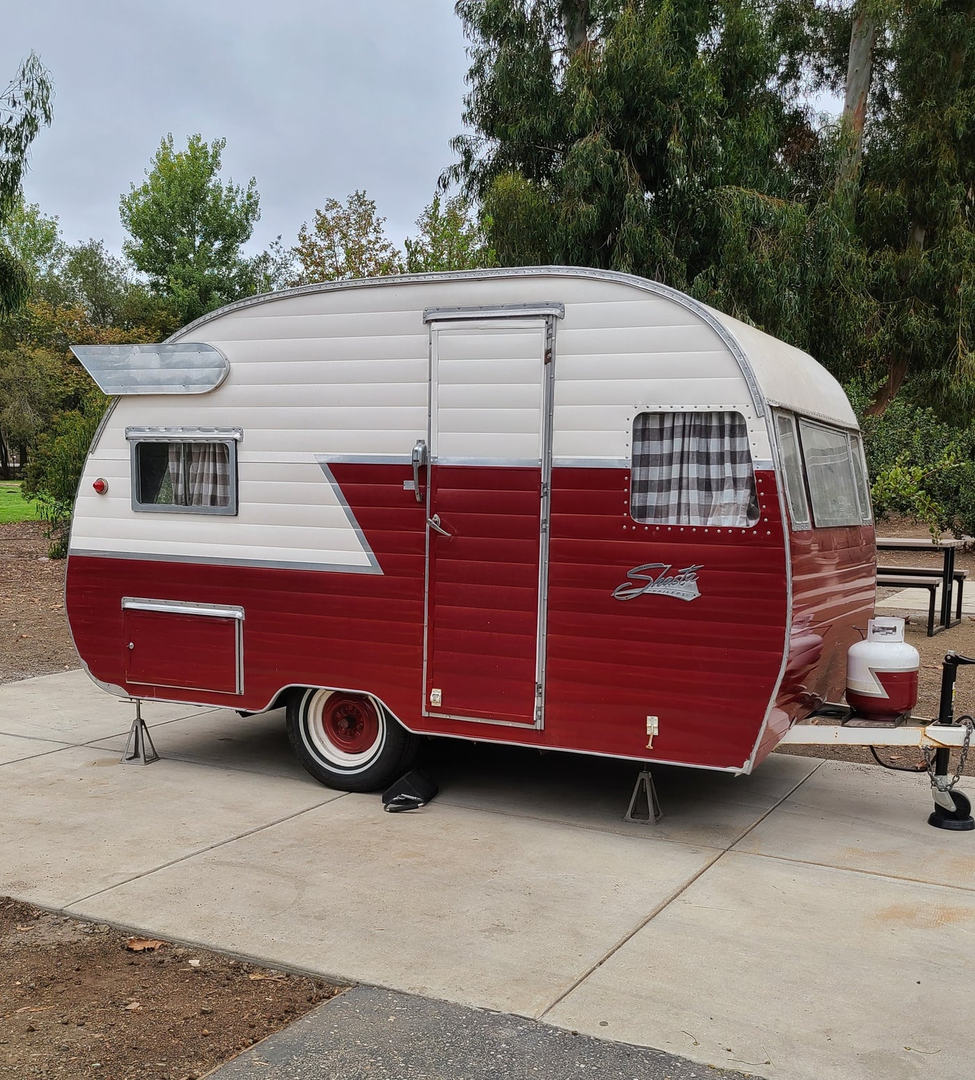 This vintage red and white Shasta travel trailer could be a unique rv rental for your next adventure. — photo 1