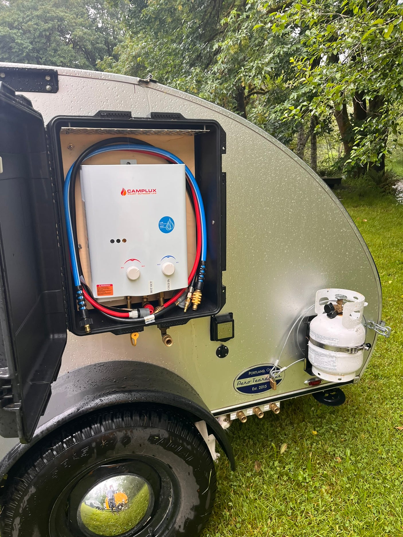 perfect for camping.|An open Dometic CFX portable fridge/freezer in an RV rental camper's slide-out outdoor kitchen