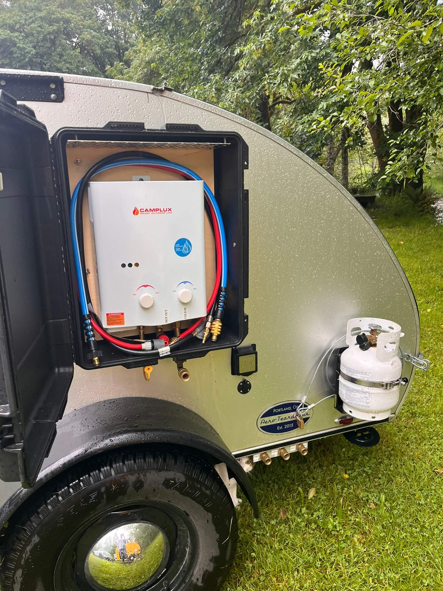 perfect for camping.|An open Dometic CFX portable fridge/freezer in an RV rental camper's slide-out outdoor kitchen