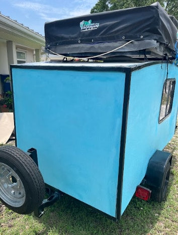 and a roof-top tent. Ideal for rv rental travel.|This blue teardrop camper