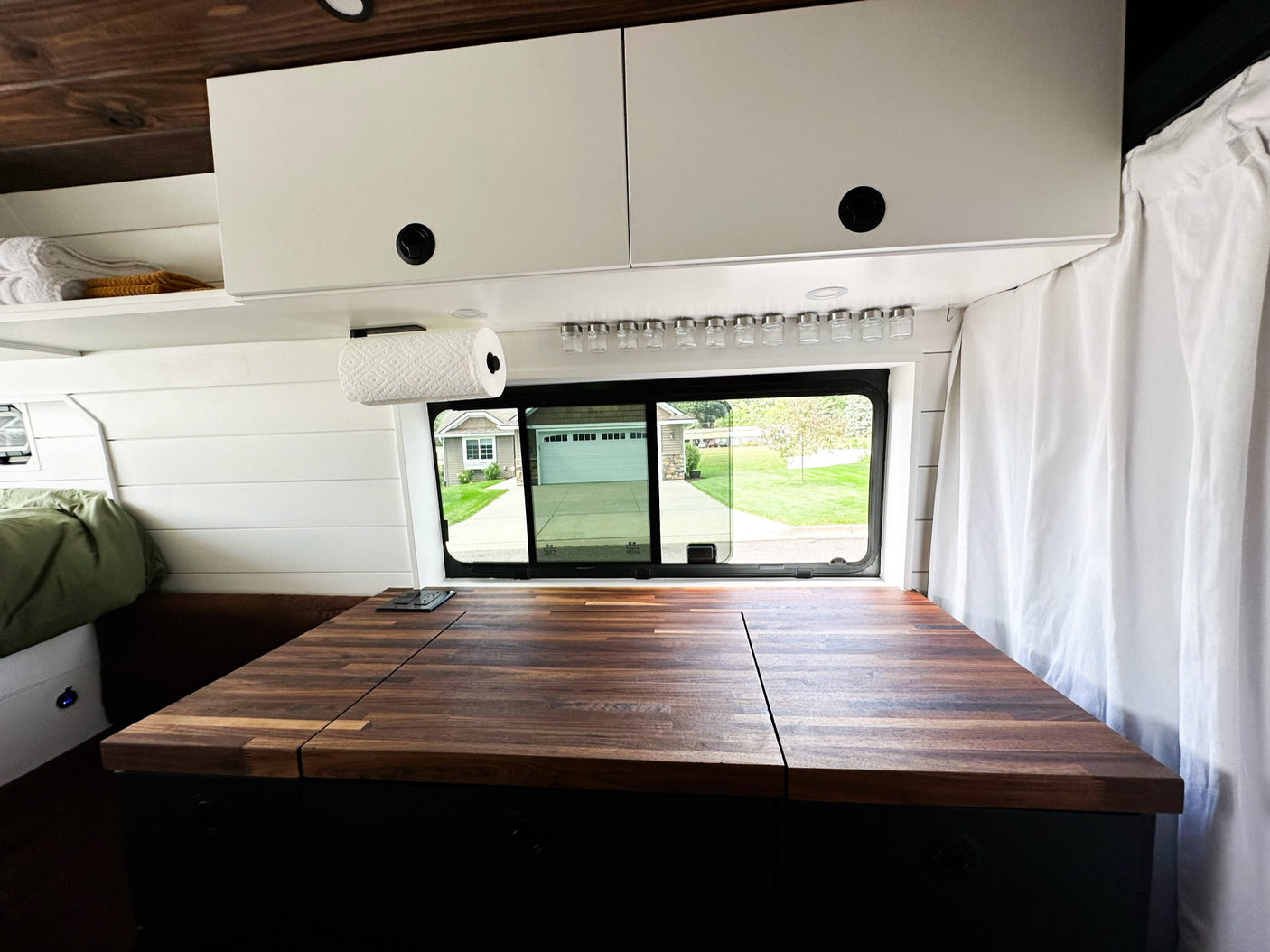 ready for your travel adventures.|Inside this modern RV rental: a comfortable bed