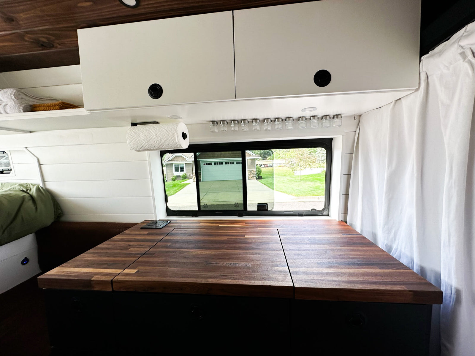 ready for your travel adventures.|Inside this modern RV rental: a comfortable bed