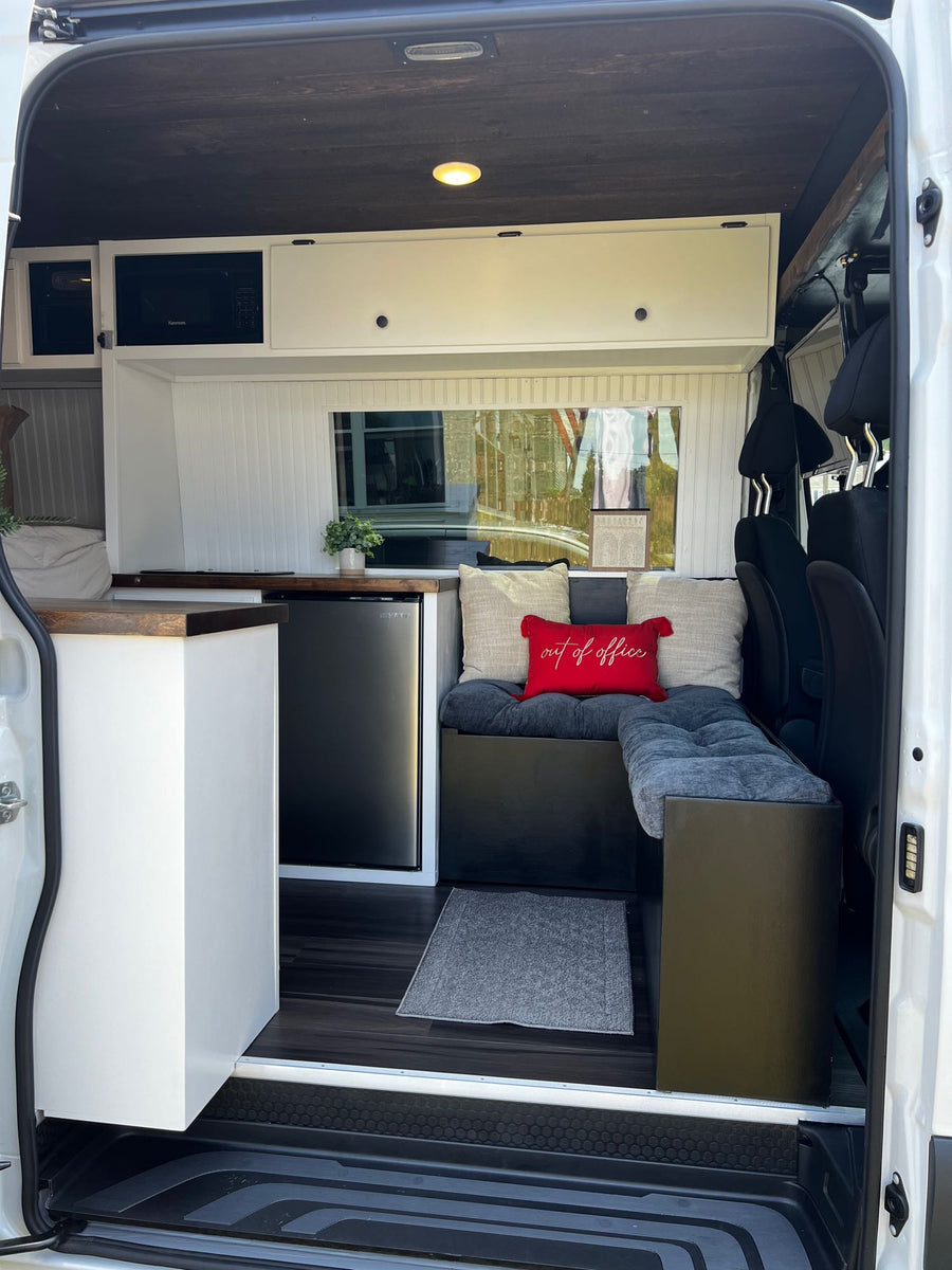 Step into this comfortable RV rental. Features a compact kitchen with microwave/fridge