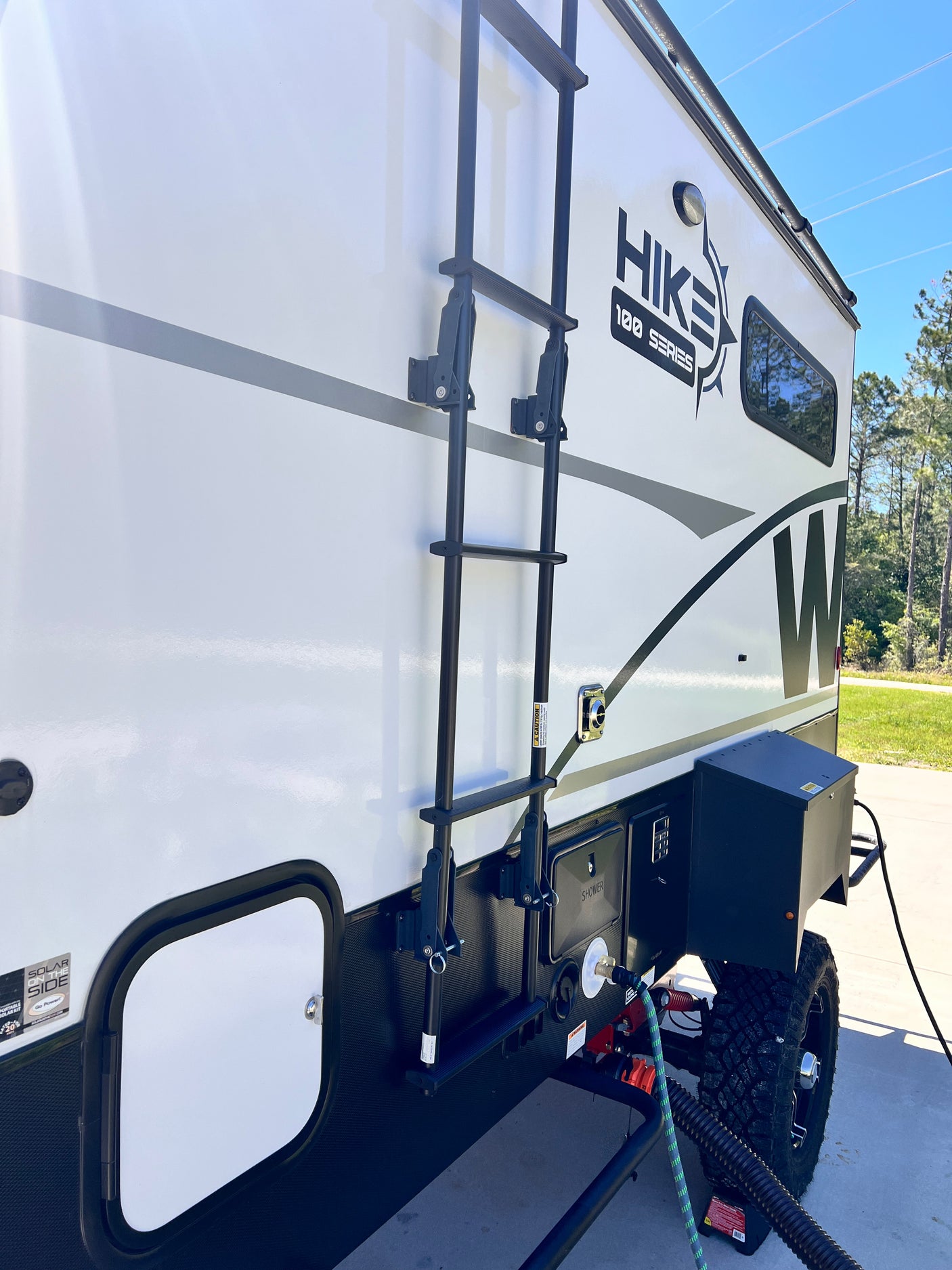 with off-road tires and an SUV.|Winnebago Hike 100 Series RV rental