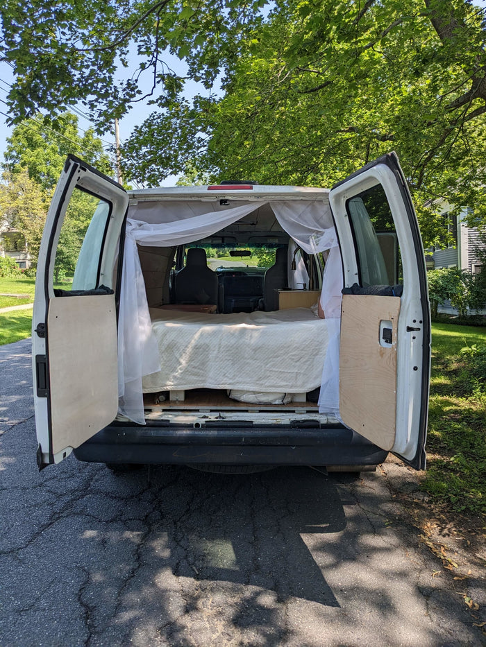 Cozy n cute 2014 Ford Econoline - sink, solar power, wood paneling