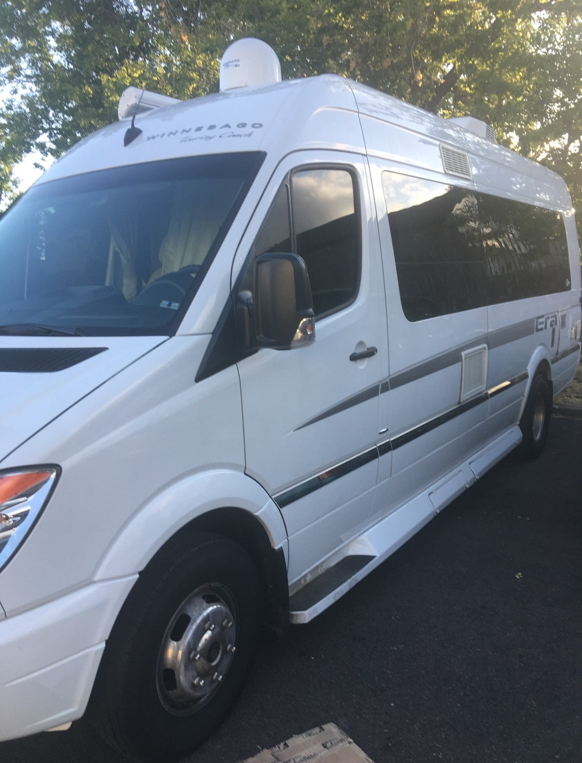 White Winnebago Era RV rental parked outdoors. This camper van is ready for your next adventure. — photo 4