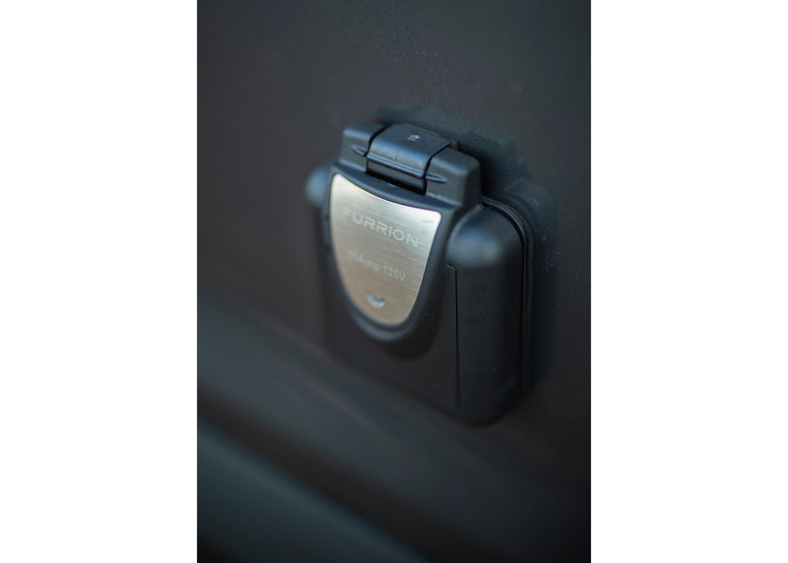 ready for your RV rental adventure.|RV rental interior: illuminated storage with pull-out drawer & campfire logo. Versatile for camping gear organization.|RV rental: Compact utility module with pull-out shower head