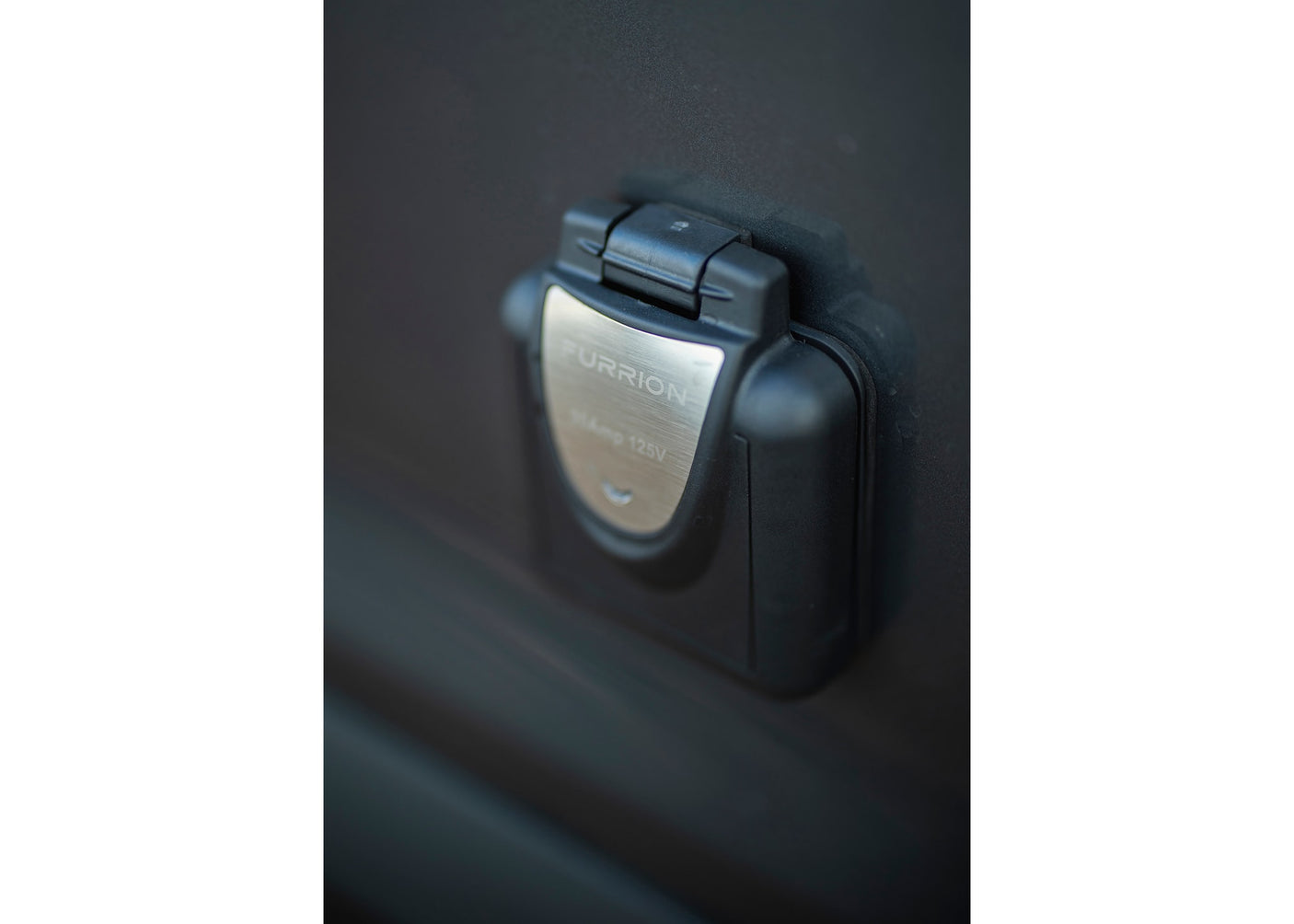 ready for your RV rental adventure.|RV rental interior: illuminated storage with pull-out drawer & campfire logo. Versatile for camping gear organization.|RV rental: Compact utility module with pull-out shower head