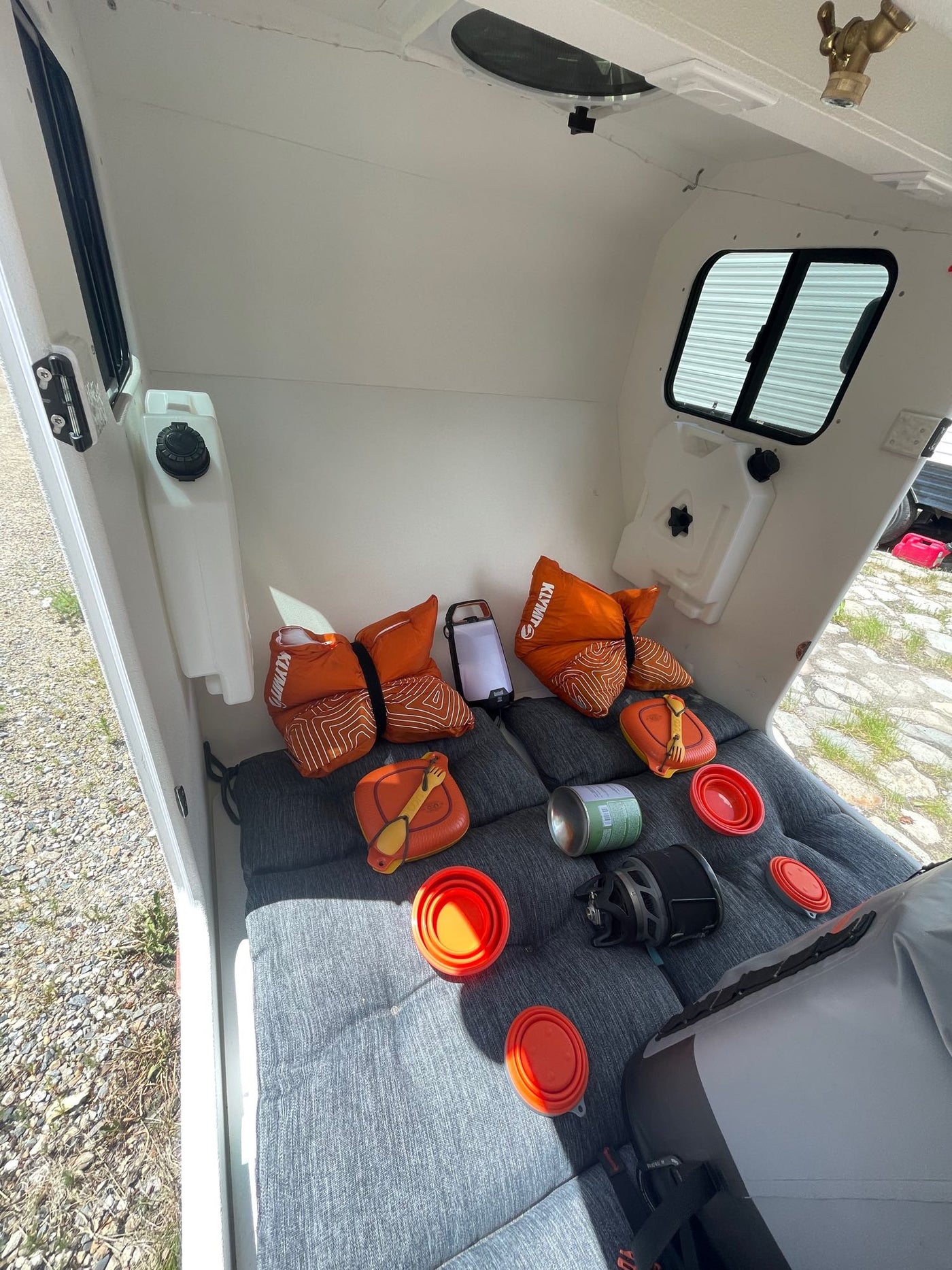 and essential camping gear for journeys.|Compact RV rental: white interior — photo 6