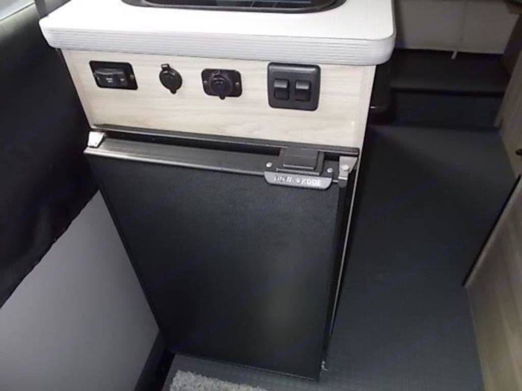 plus a window.|RV rental cooking: A two-burner Suburban stove with open glass lid