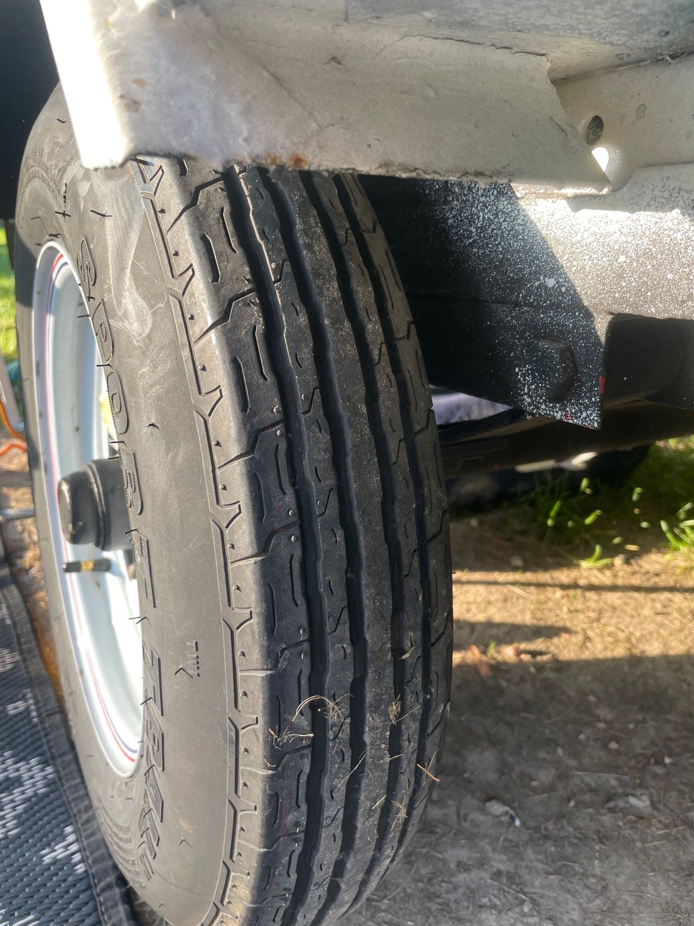 parked in a sunny South Carolina neighborhood. License Y 32306.|A white