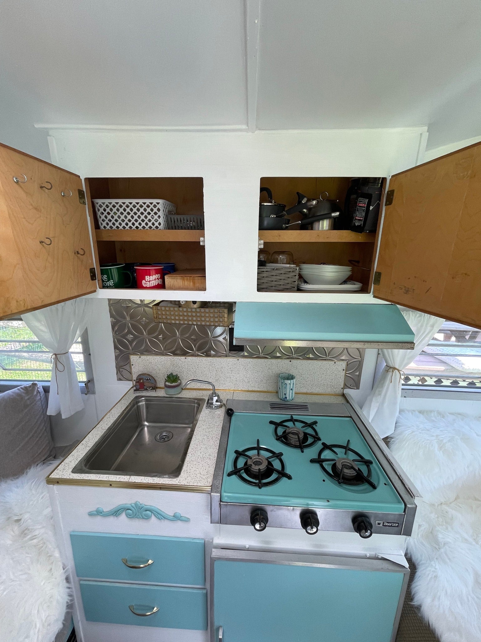 complete with a stove and sink