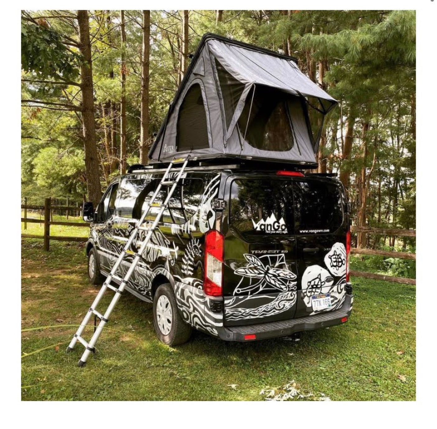 Black Ford Transit RV rental with a rooftop tent and ladder