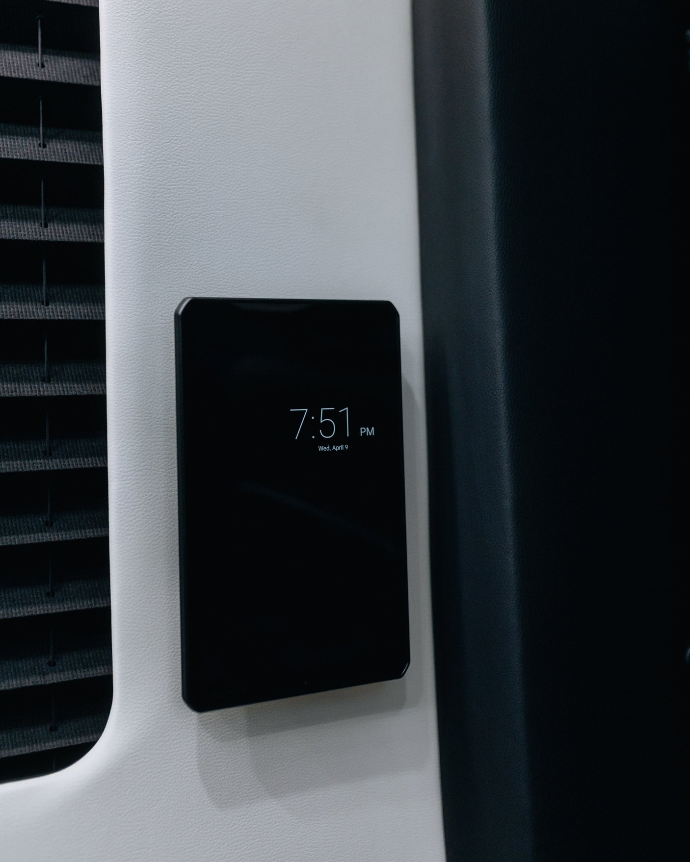 RV rental vehicle interior featuring a digital control panel displaying 7:51 PM Wed, April 9, on a light wall.