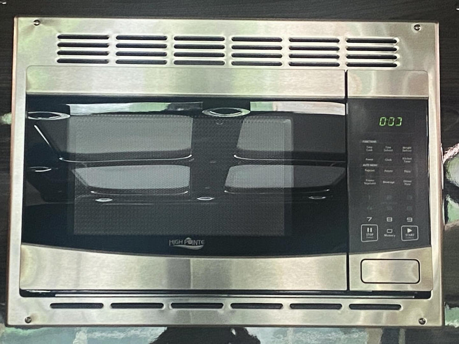 revealing a spacious beige custom interior and tow hitch.|Luxury RV rental features a built-in entertainment system with a large screen displaying numerous streaming apps and gaming options.|RV rental's luxurious interior: cream quilted leather seats