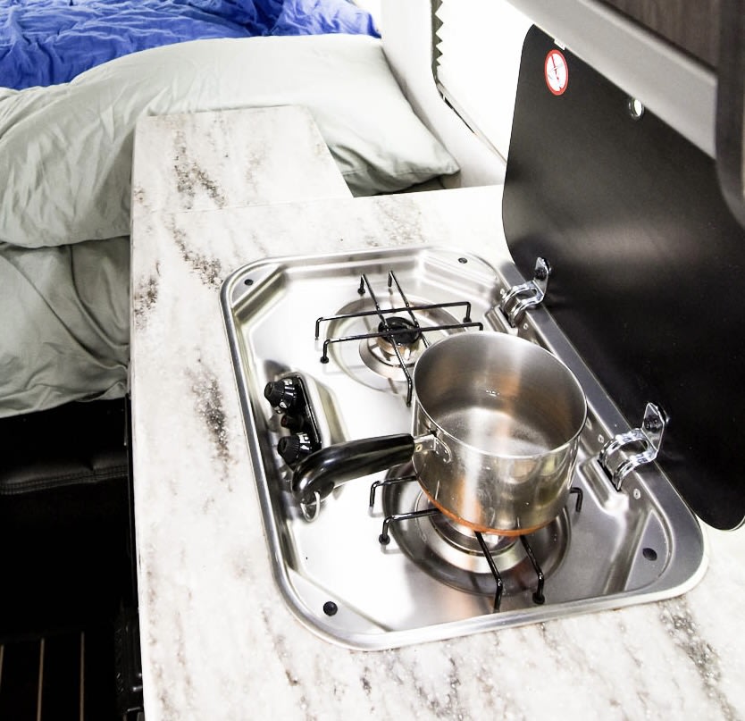 past a kitchen counter with sink/cooktop — photo 6